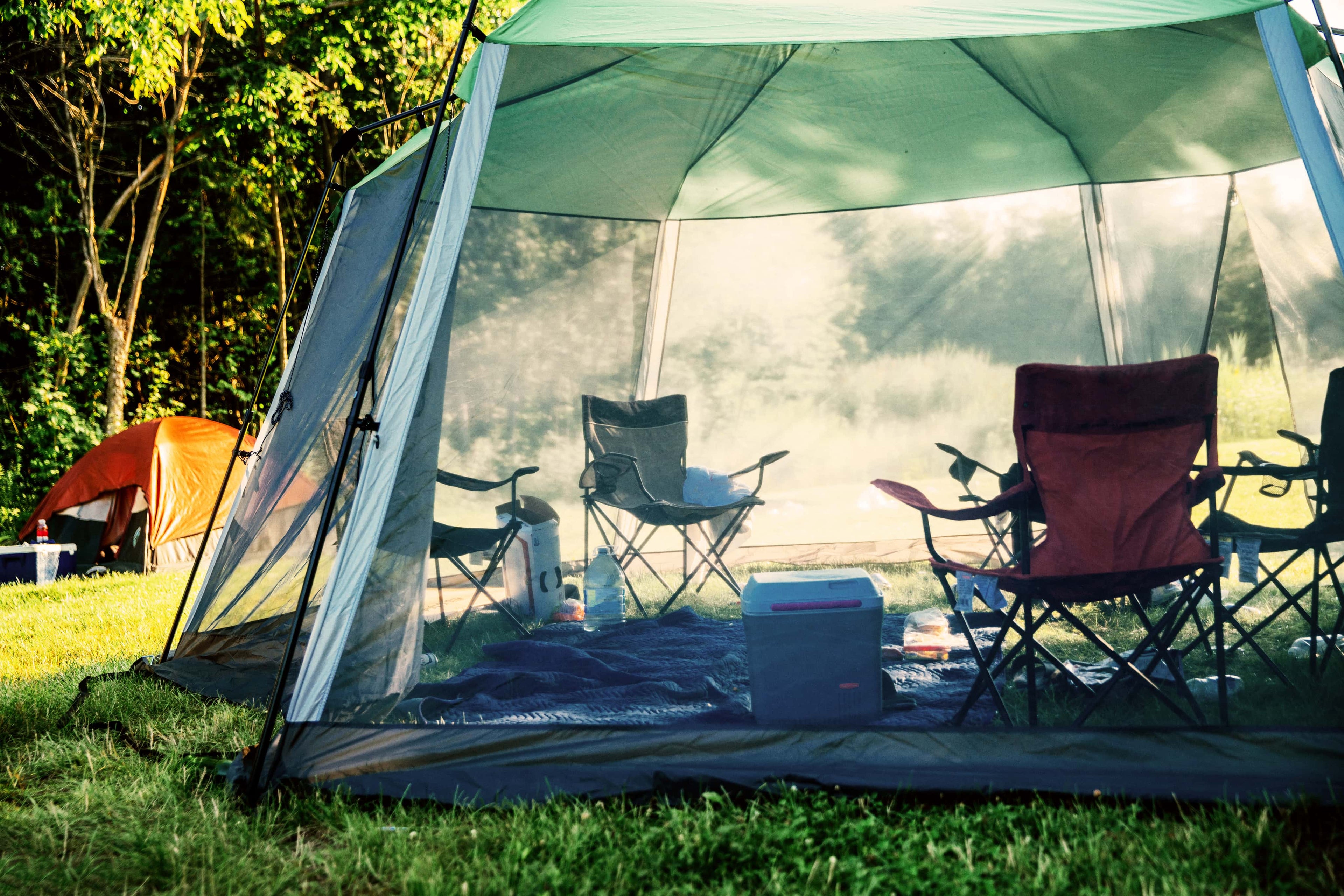 Camping tents with chairs inside